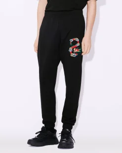 Online Pantal&oacute;n cl&aacute;sico de ch&aacute;ndal con bordado 'Year of the Dragon' Hombre Pantalones